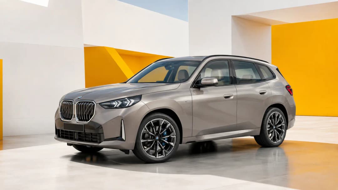BMW X3 parked beside contemporary architecture