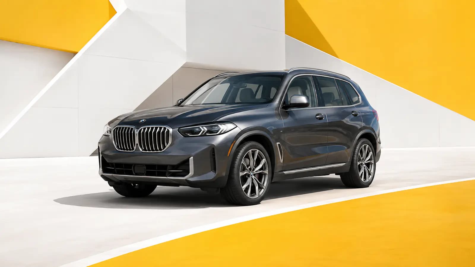 BMW X5 driving on a scenic road in Luxembourg